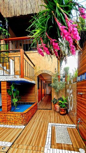 Praia Pousada Casa das Flores Camburi Menor preço em Praia Pousada Casa das Flores Camburi