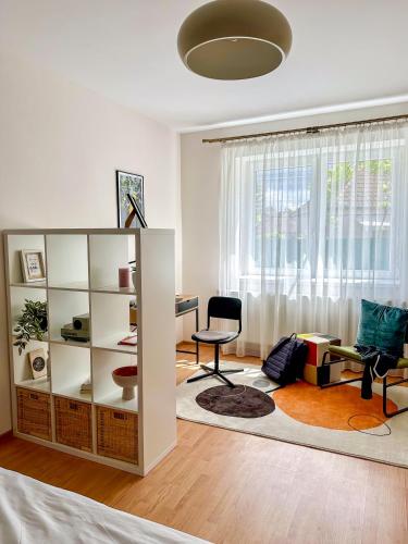 a living room with a desk and a chair at Serenity House Apartments in Sibiu