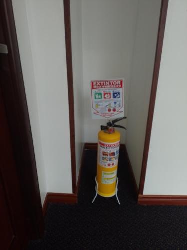 a fire hydrant with a sign on top of it at Hotel Boutique Quinta Camacho in Bogotá