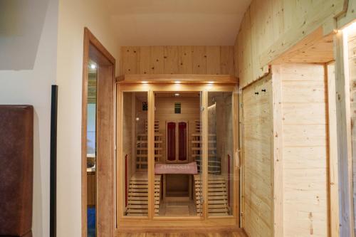 a room with a chair in the middle of a building at Chalet Aignerhof in Flachau