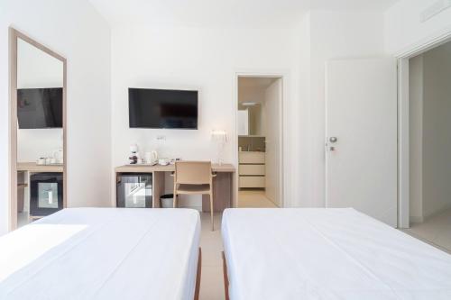 Ein Bett oder Betten in einem Zimmer der Unterkunft Dimore delle Zagare Molo