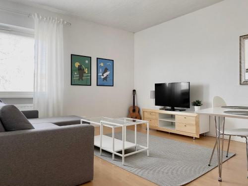 Et tv og/eller underholdning på Spacious apartment with FREE parking