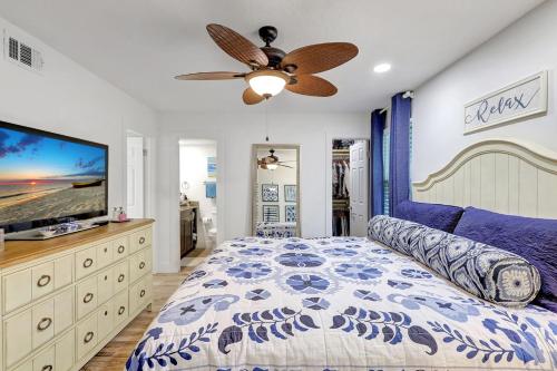 a bedroom with a bed and a ceiling fan at 1166 PD Contemporary Coastal Luxury in Siesta Key