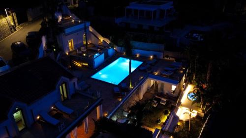 an overhead view of a swimming pool at night at Villa Zagara Garden Spectacular Sea View in Taormina in Taormina