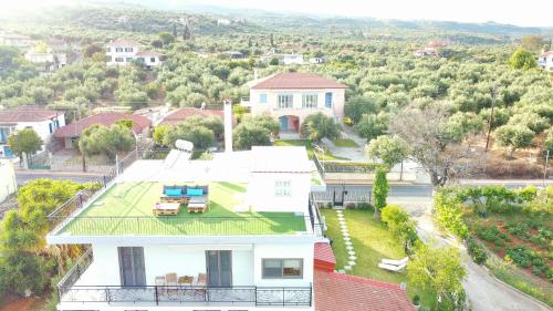 an aerial view of a house with a green roof at Blue Diamond in Chrani