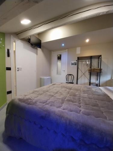 a bedroom with a large bed in a room at B&B Staziona e Dormi in Camigliatello Silano