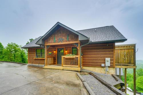 a wooden cabin with a porch and a driveway at Private Hot Tub Gatlinburg Cabin in the Clouds in Gatlinburg