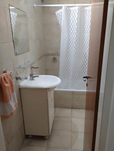 a bathroom with a sink and a shower and a tub at Hermoso Duplex en San Miguel in General Sarmiento