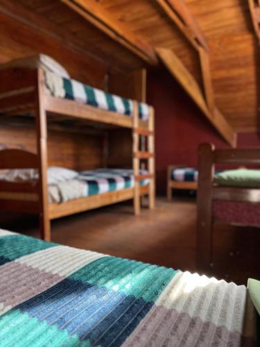a bedroom with two bunk beds in a house at Hebes House in Caviahue