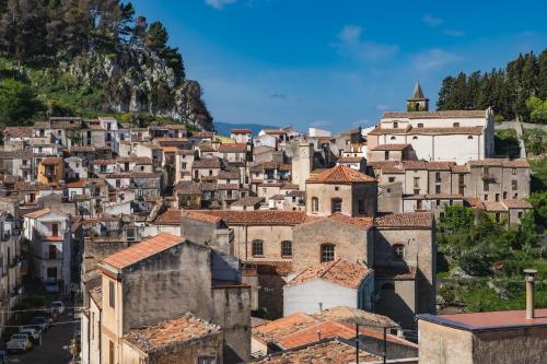 a town on a hill with houses and buildings at Case Ruggieri Luxury apt - Don Pietro in Gratteri