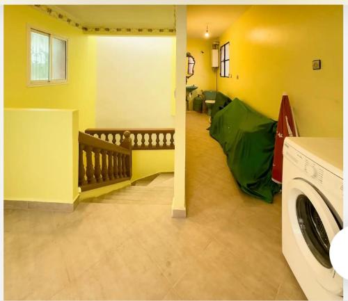 a laundry room with a washing machine and a green tent at Villa calme a tamuda bay médique region de tetuan in M'diq