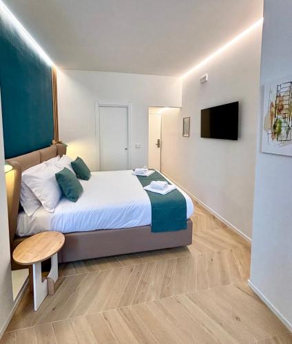 Ένα ή περισσότερα κρεβάτια σε δωμάτιο στο Reno Suite Bologna