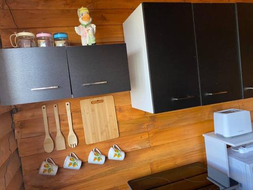 a kitchen with knives and utensils on the floor at Cabaña Princesa Roja - PERFECT view of the valley! in San Pablo