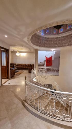 una scala in una casa con soffitto in vetro di Villa with riad style a Fes