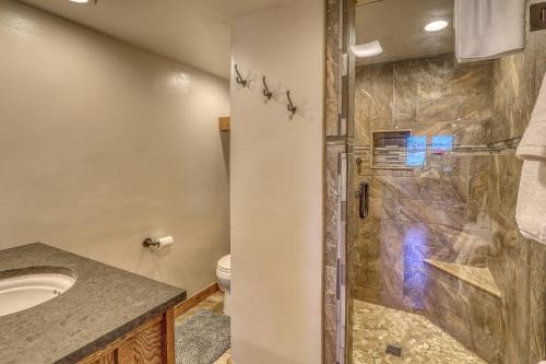 a bathroom with a shower and a sink and a toilet at 766 Dichoso in Pagosa Springs