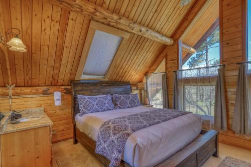 a bedroom with a bed in a log cabin at 766 Dichoso in Pagosa Springs