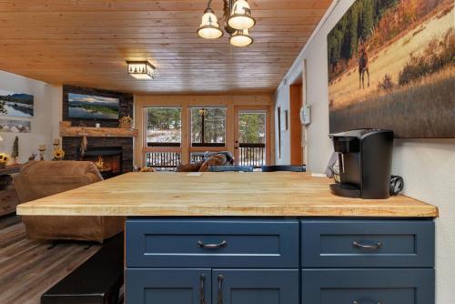 a kitchen with a wooden counter top in a room at Creekside Suites 12 by Estes Park Condos in Estes Park