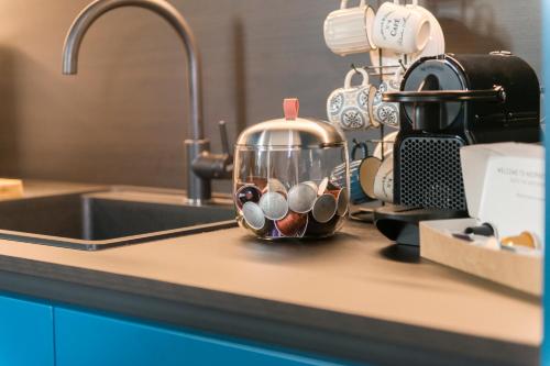 a kitchen counter with a mixer and a sink at Aschitelli luxury retreat in Polignano a Mare