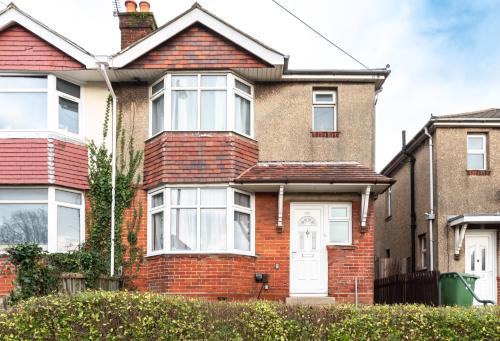 a red brick house with a white door at 6 beds in 4 bedrooms house in Southampton