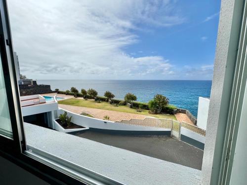 a view of the ocean from a window at Lunamar Luxury Place in Bajamar