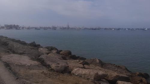 a group of rocks on the side of a body of water at CASA VACACIONAL URBANIZACIÓN PROGRESIVA in Manta