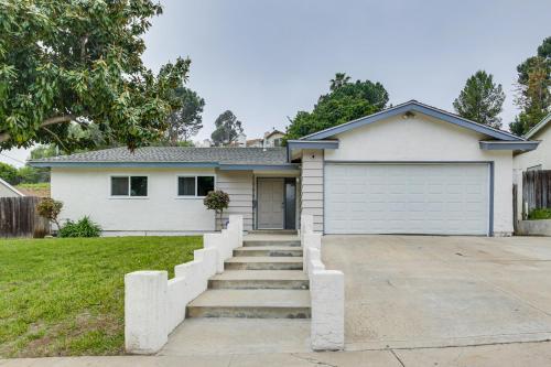 a white house with a garage at San Diego Home AC, Hot Tub, Covered Patio and BBQ in Spring Valley