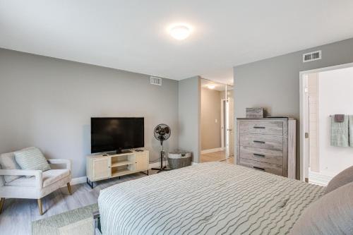 a bedroom with a bed and a flat screen tv at San Diego Home AC, Hot Tub, Covered Patio and BBQ in Spring Valley