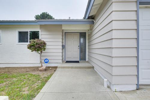 a white house with a door on the side of it at San Diego Home AC, Hot Tub, Covered Patio and BBQ in Spring Valley