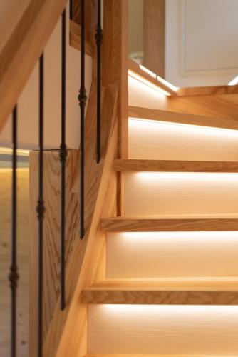a set of wooden stairs with lights on them at Urlaub am See Seehaus Salzburg Mattsee Obertrum Seeham Salzburger Seenland in Obertrum am See