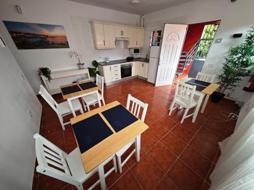 an aerial view of a kitchen with a table and chairs at La concha in La Laguna