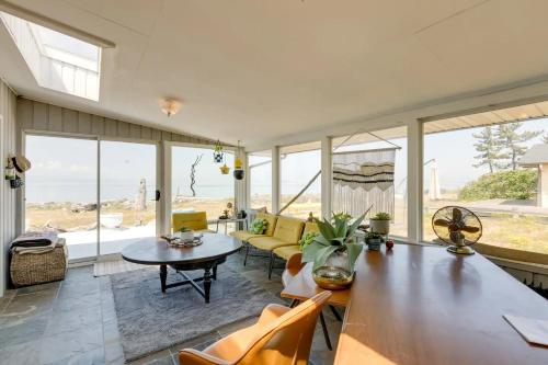 a living room with a table and a couch at Beach House Point Roberts in Point Roberts