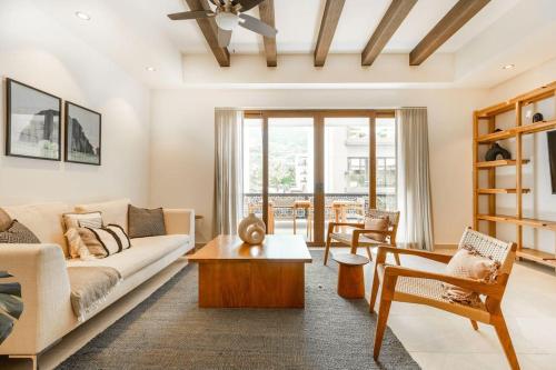 a living room with a couch and a table at Urban by Pardela in Puerto Vallarta