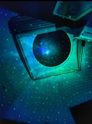 a view of the stars from the inside of a spaceship at Iglú Popeye a 6 minutos de la paya in Barra de Navidad