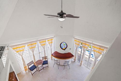 an overhead view of a dining room with a table and chairs at Casa Cenote Hotel in Tankah