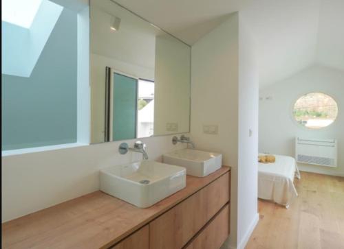 a bathroom with a sink and a mirror at Villa Emerald Oeiras Lisbon in Oeiras