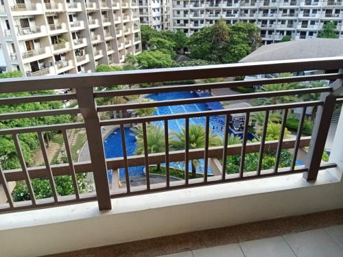 a balcony with a view of a river at Asteria Lovely Staycation in Manila