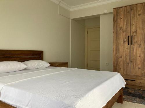 Postel nebo postele na pokoji v ubytování Moda Tatil Evleri