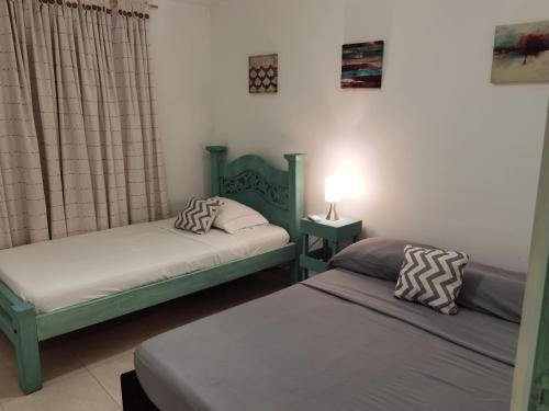 Letto o letti in una camera di Apartahotel Santori Cartagena