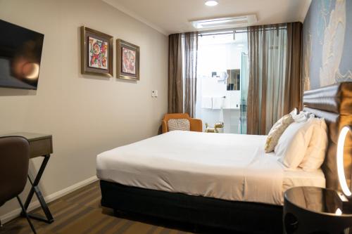 Un ou plusieurs lits dans un hébergement de l'établissement 57Hotel