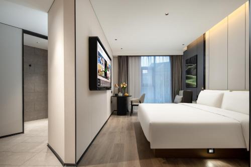 Μια τηλεόραση ή/και κέντρο ψυχαγωγίας στο Atour Hotel Ningbo Cixi Ancient Town