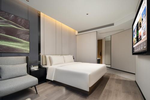 Μια τηλεόραση ή/και κέντρο ψυχαγωγίας στο Atour Hotel Ningbo Cixi Ancient Town
