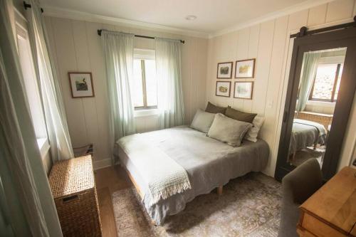 a small bedroom with a bed in a room at Modern Luxury Cabin - Hot Tub, Hiking, Hammocks in Cascade-Chipita Park