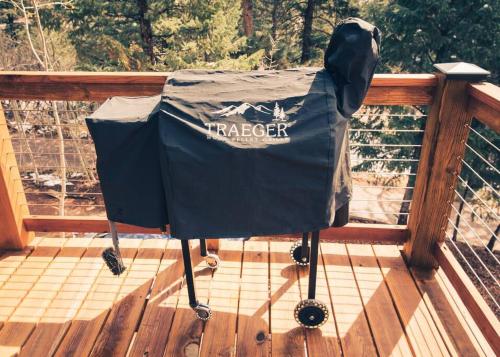 a tarleton bag sitting on top of a deck at Modern Luxury Cabin - Hot Tub, Hiking, Hammocks in Cascade-Chipita Park