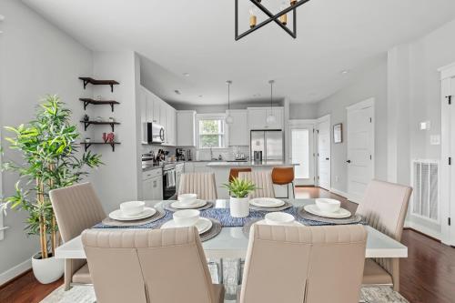 a kitchen and dining room with a table and chairs at Richmond Gem, Free Parking, Quiet, Fenced,Walkable in Richmond