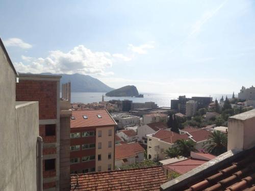 a view of the city and the ocean from a building at Apartmani Vila Marija in Budva