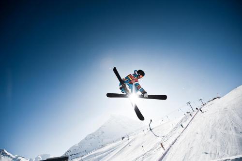 a man flying through the air on a pair of skis at Apart Renate in Galtür