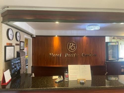 a hotel reception counter with a hotel plectric center at Hotel Pacific Garden in Gardena