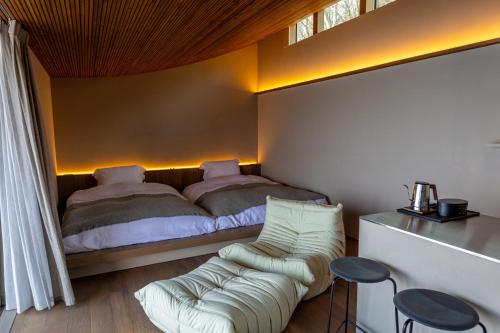 Postel nebo postele na pokoji v ubytování 千年オリーブテラス for your wellness 「The STAY」