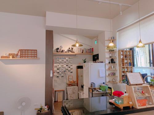 a kitchen with a counter and a refrigerator at 日日和 in Tainan