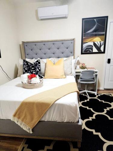 a bedroom with a large bed and a desk at Beautiful All Private GuestSuite in Lancaster
